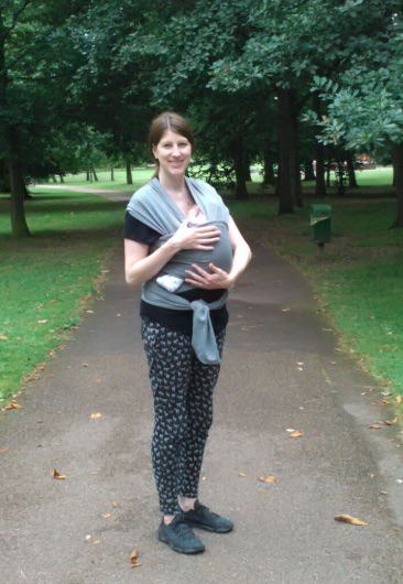 Amy Maureen Lynch walking with her newborn in Queen's Park, London, England before beginning a Campus for Mums startup program with Google for Startups.