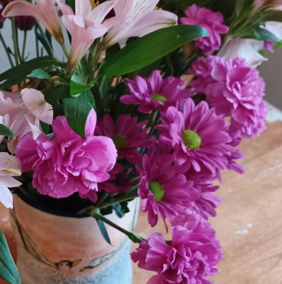 Handbuilt, carved and underglaze painted Children of Lir large vase with Spring pink and purple flower bouquet 